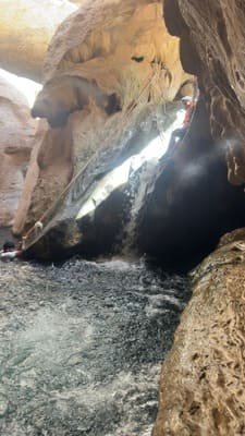 Hidden cave waterfall at Wadi Shab — swim-through channel Oman